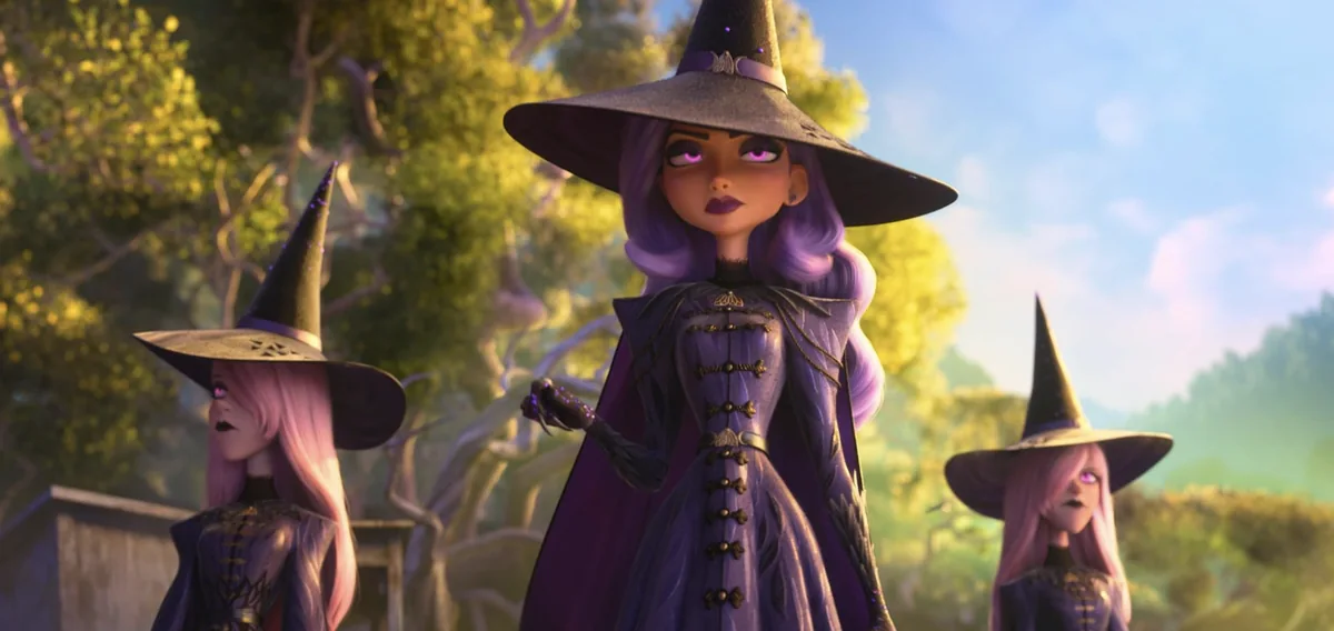 Three animated witches wearing pointed hats stand on a sunlit path.